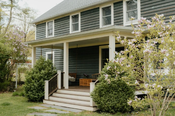 a house with a porch and steps leading to the front door